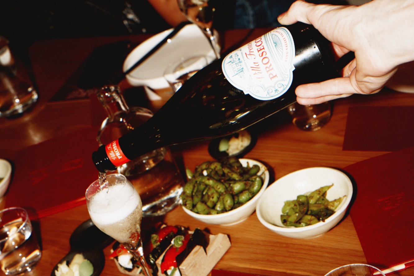 Prosecco being poured at a Token Private Dining event