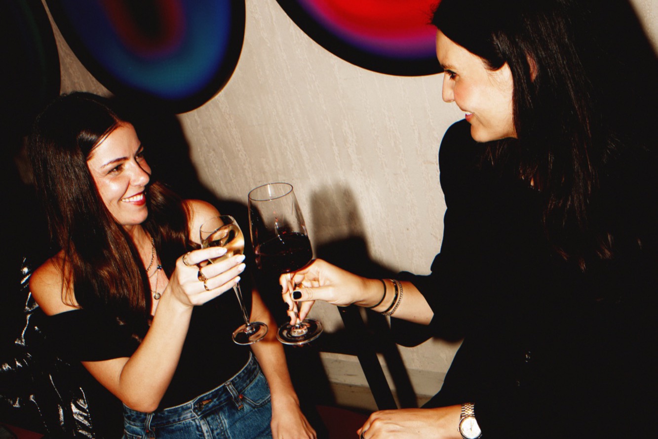 Guests toasting wine at Token Private Dining